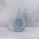 "Sitting, front-facing, empty MARBLE TEARDROP planter, showcasing its elegant marble pattern and sleek design."
